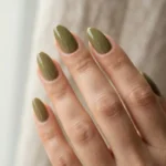 Almond nails in a glossy warm muted olive green creme