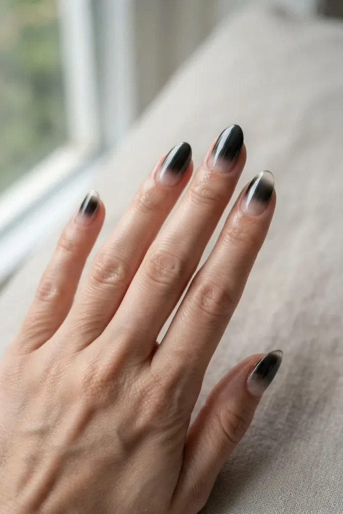 Black chrome fading from the cuticle out to clear tips