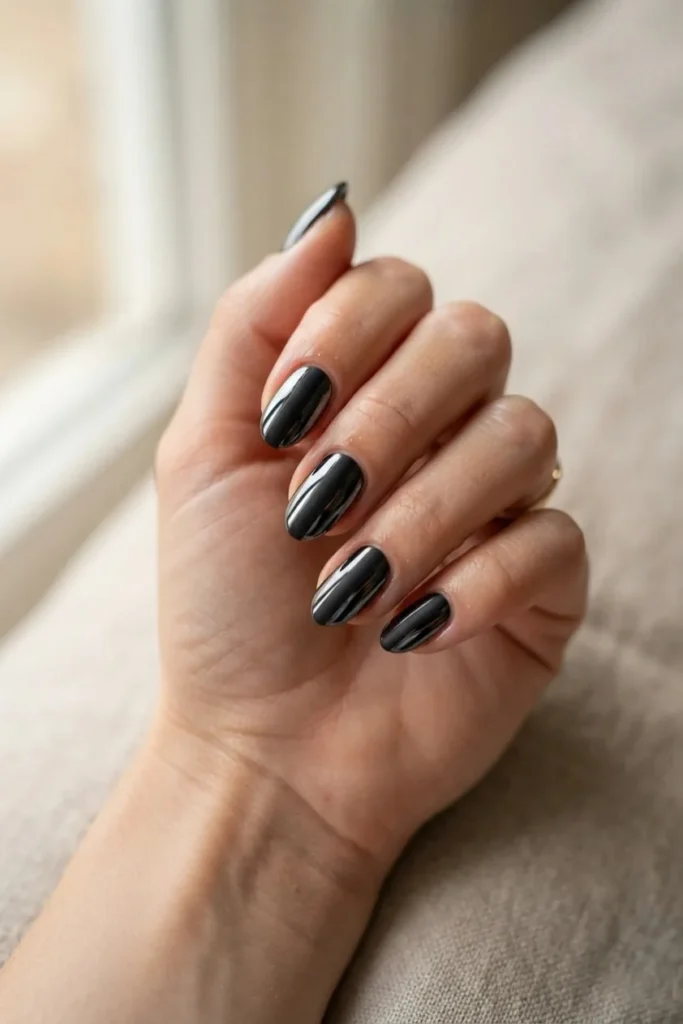 Black mirror chrome nails with a wide matte stripe down the center of each nail