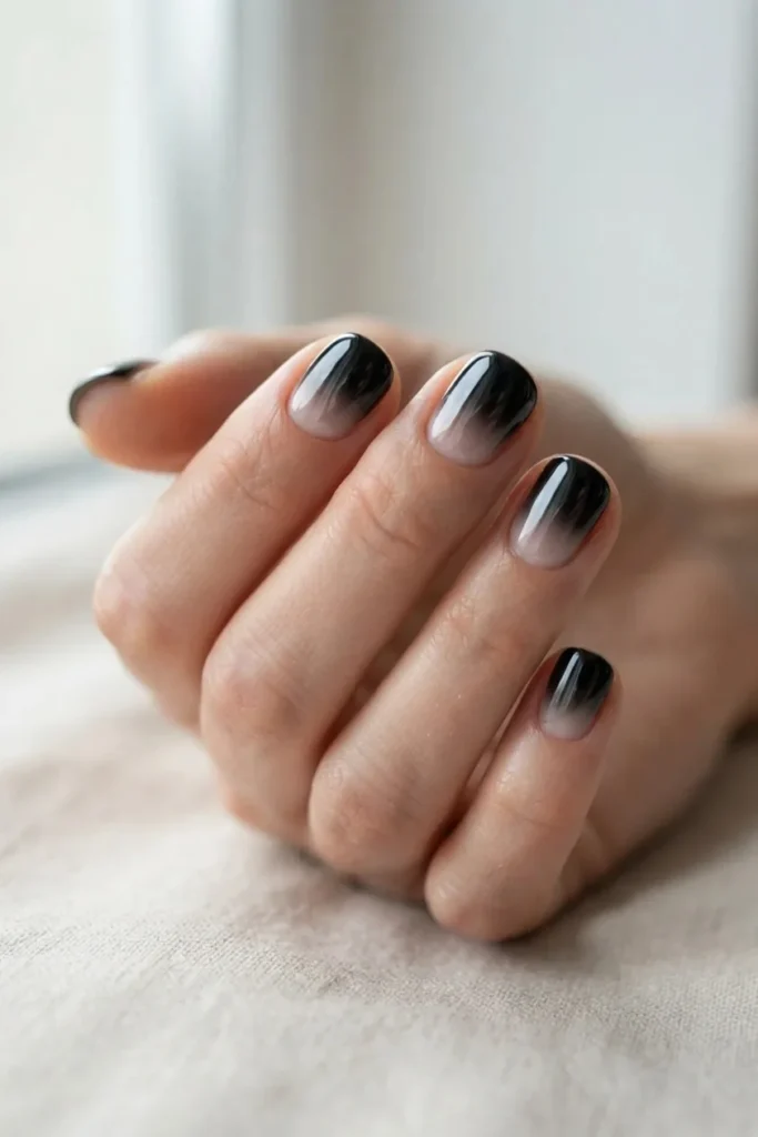 Black chrome fading from a full mirror finish at the tips to almost nothing at the cuticle