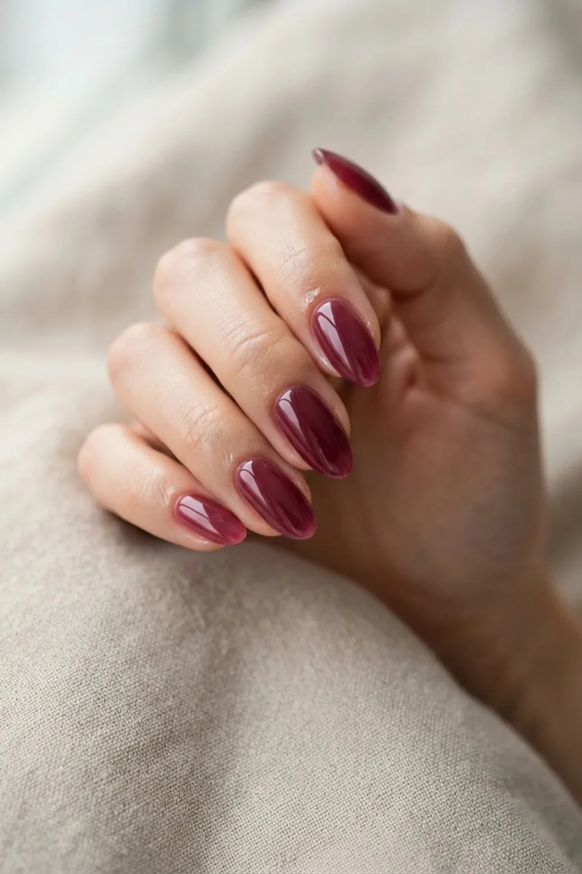 Matte burgundy manicure with one glossy accent nail