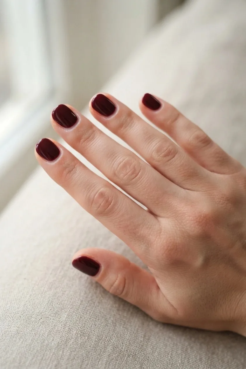 Burgundy and chocolate brown color blocked across the nail