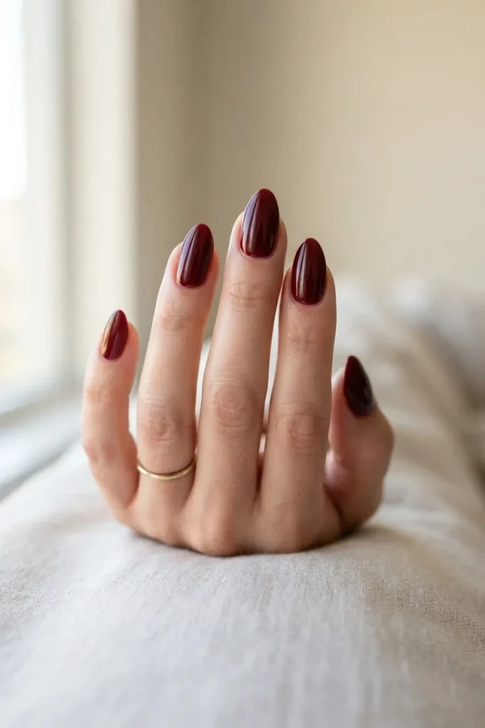 Almond nails in a deep oxblood red creme polish