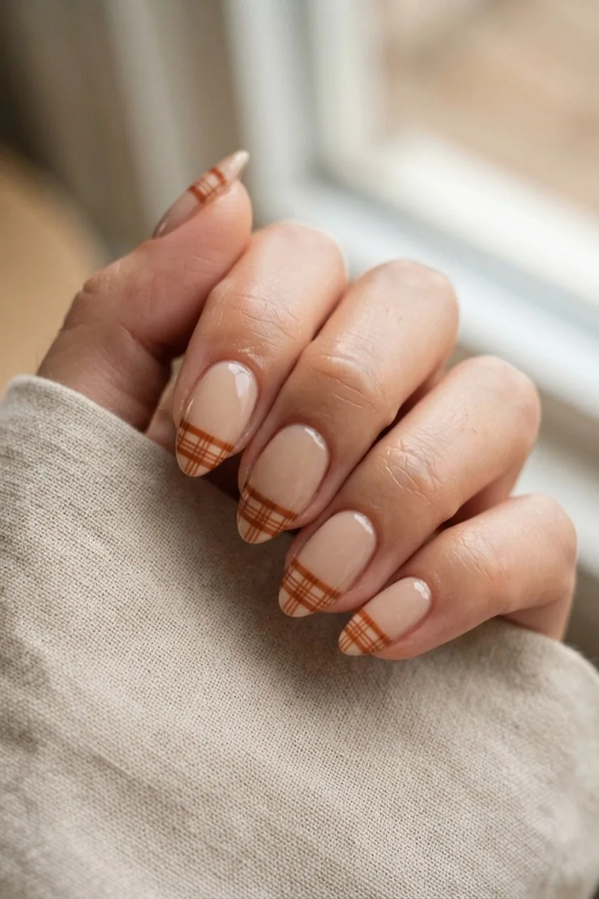 Small plaid check pattern confined to the French tip