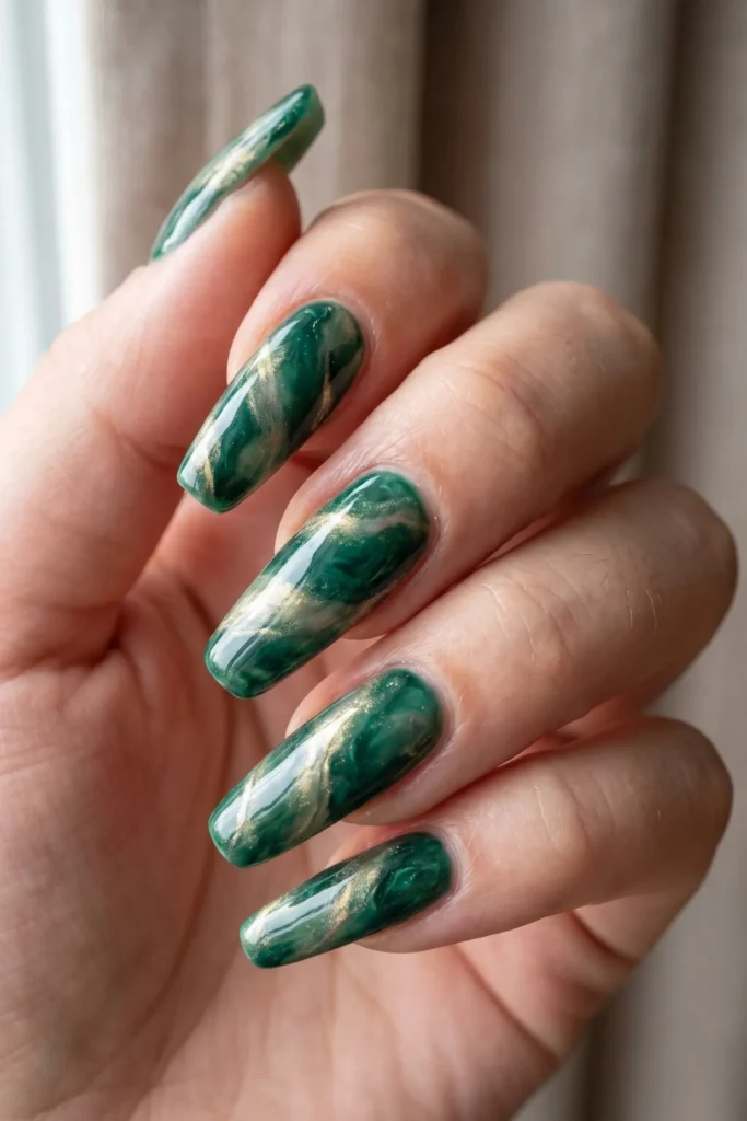 Green and gold marbled Christmas nail design