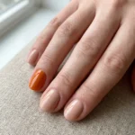 Single orange accent for short nails